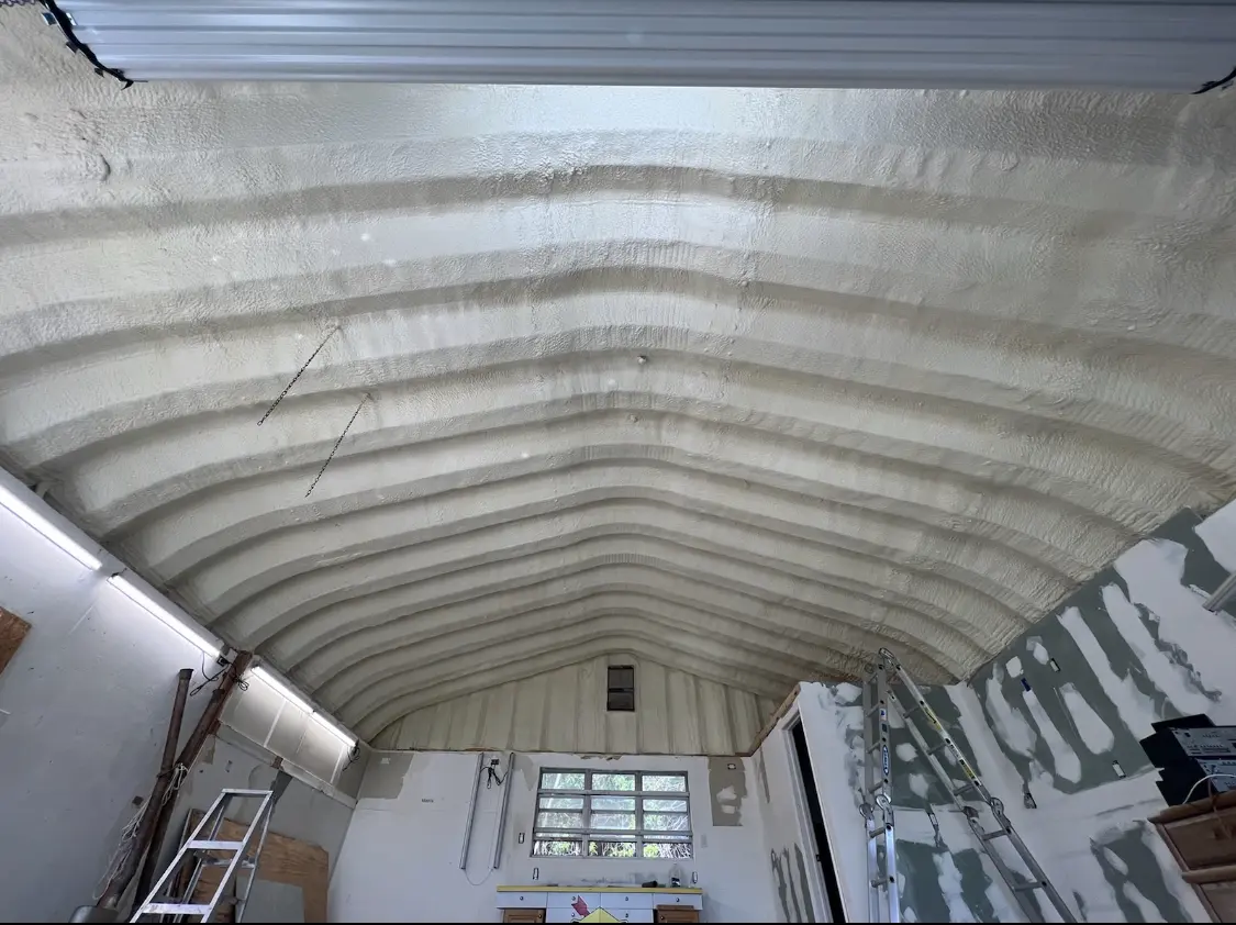 Spray polyurethane foam applied to the underside of a metal roof deck in Southeast
